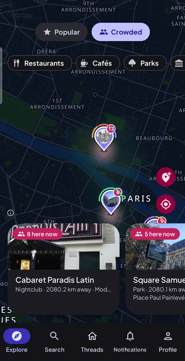 Paris on the Crowded view: a nightclub with twelve people at it, a square with eight